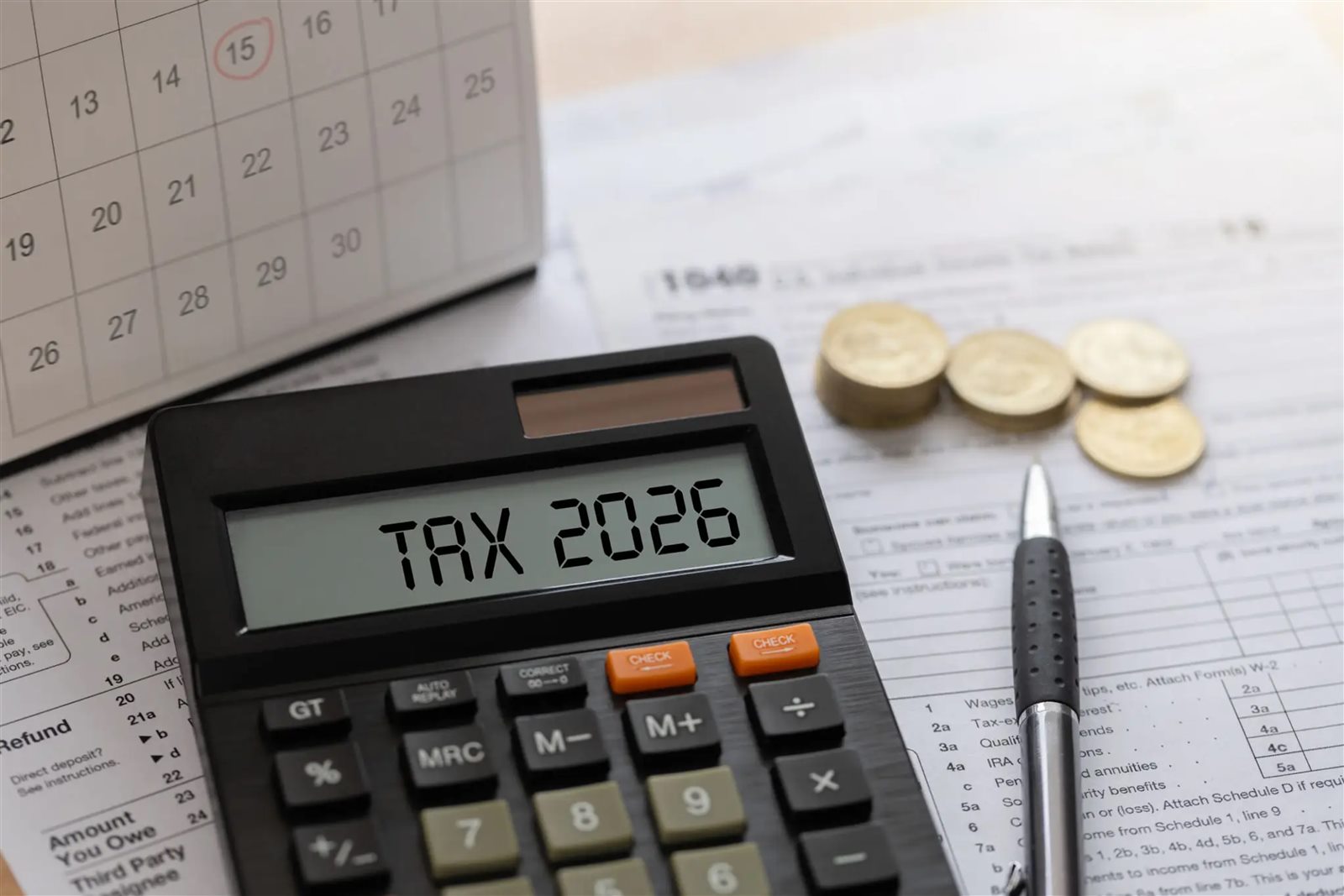 IRS tax forms and calculator on a desk