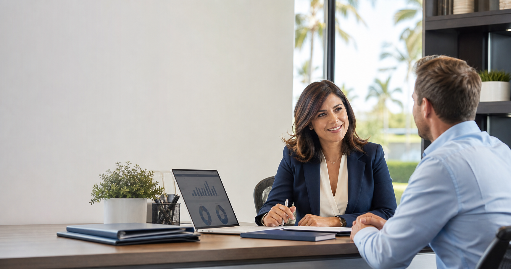 Tax professional consulting with a small business owner in a modern office